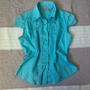 Capacity Unlimited light blue vest with floral design